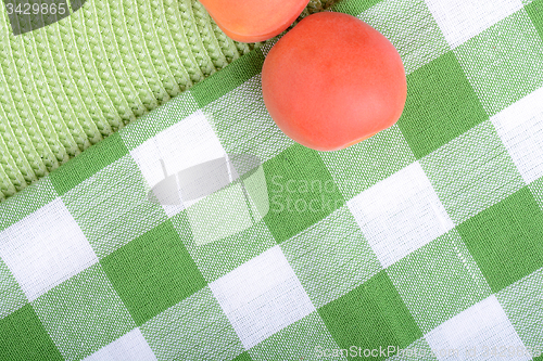Image of Full peaches close up on green background.