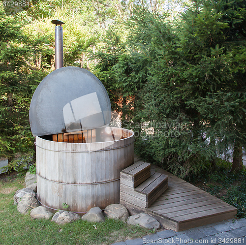 Image of Wooden hot tub in the alps