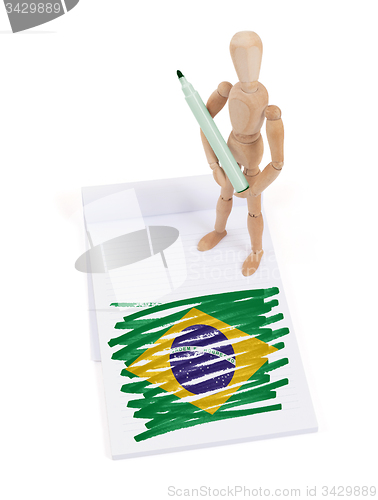 Image of Wooden mannequin made a drawing - Brazil