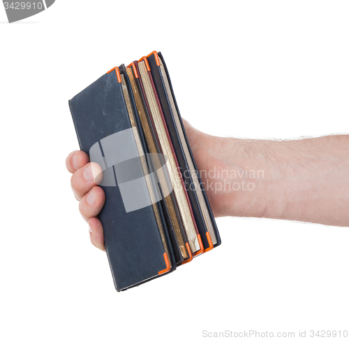 Image of Old diaries in a hand