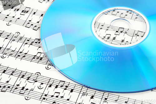 Image of Blue CD or DVD on sheet music