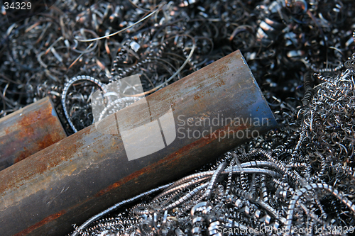 Image of steel pipes on shavings