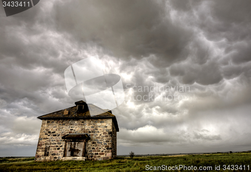 Image of Storm Clouds Prairie Sky stone house