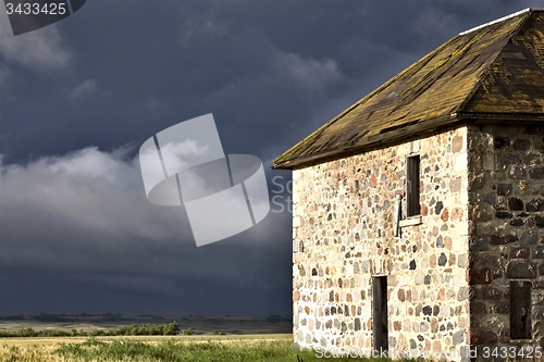 Image of Storm Clouds Prairie Sky Stone House