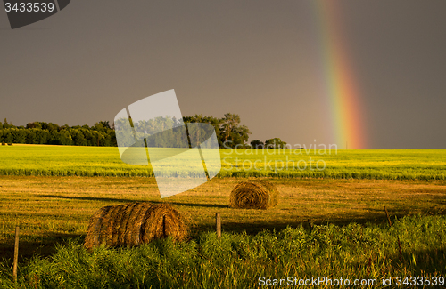 Image of Storm Clouds Prairie Sky Rainbow