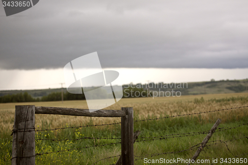 Image of Storm Clouds Prairie Sky Fence