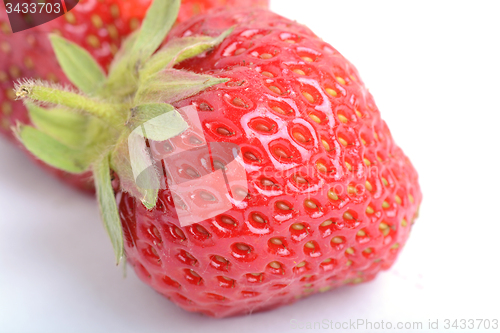 Image of fresh strawberries close up isolated on a white background