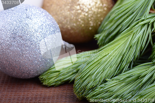 Image of Christmas tree branch with ball