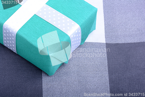 Image of holiday Green gift box with white ribbon