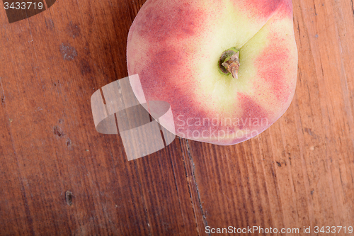 Image of peach set on the wooden background