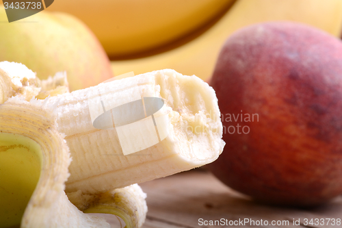 Image of fruits on table, apple, bananas, peach close up, health food concept