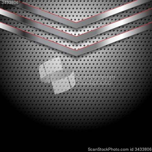 Image of Abstract perforated metallic background with arrows