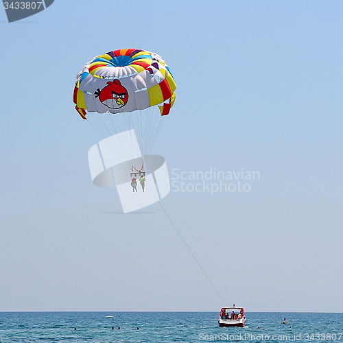 Image of Parasailing in a blue sky.