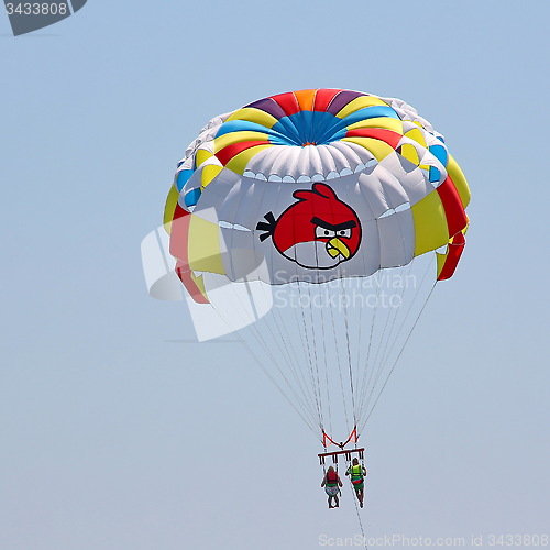 Image of Parasailing in a blue sky.