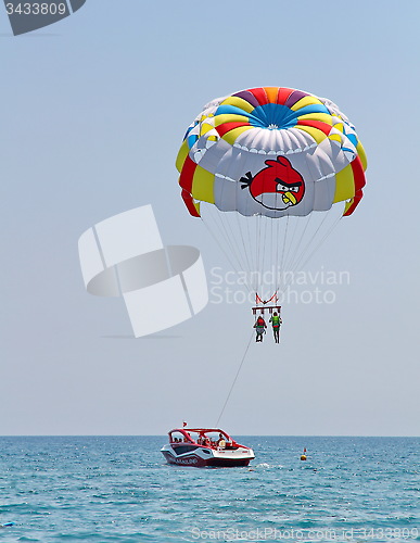 Image of Parasailing in a blue sky.