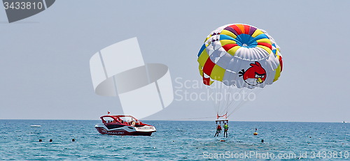 Image of Parasailing in a blue sky.