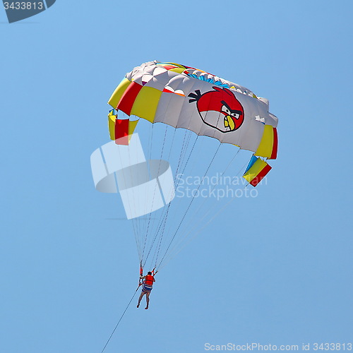 Image of Parasailing in a blue sky.