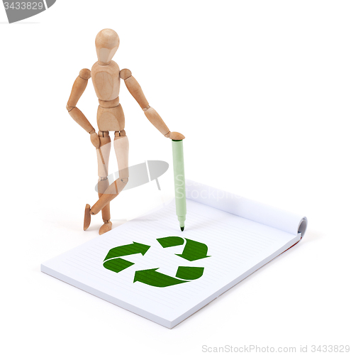 Image of Wooden mannequin writing - Recycle