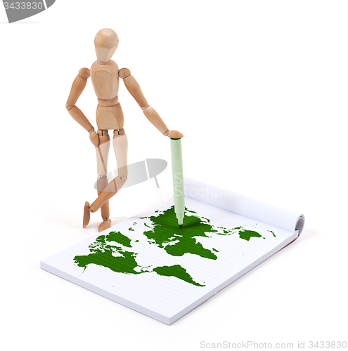 Image of Wooden mannequin writing - World map