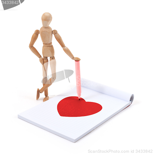 Image of Wooden mannequin writing - Heart