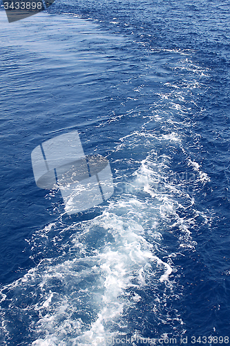 Image of Blue sea water with trace of the boat 