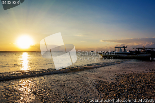 Image of Nusa penida, Bali beach with dramatic sky and sunset