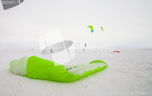 Image of Kiteboarder with kite on the snow