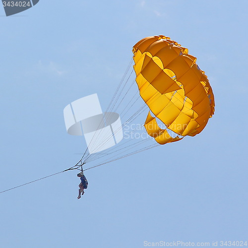 Image of Parasailing in a blue sky