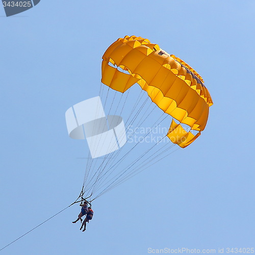 Image of Parasailing in a blue sky