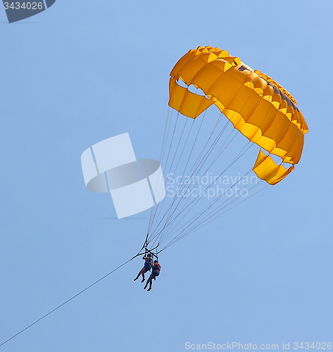 Image of Parasailing in a blue sky