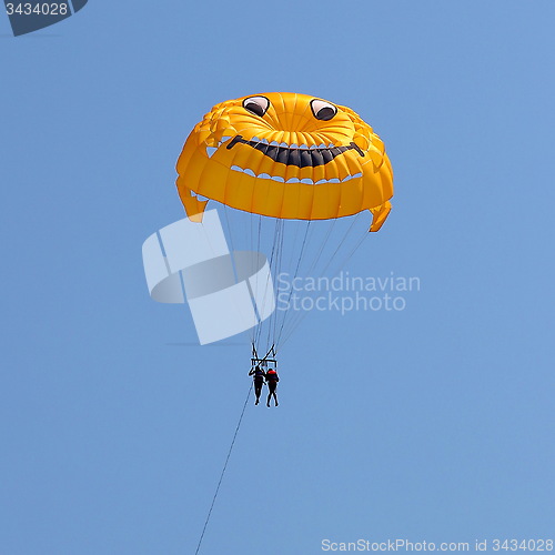 Image of Parasailing in a blue sky