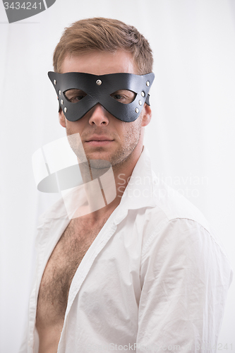 Image of Handsome guy in the BDSM leather mask 