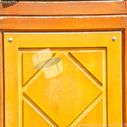 Image of texture of a brown old door in italy europe