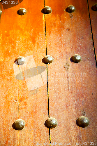 Image of   in the brown wood door and rusty yellow red