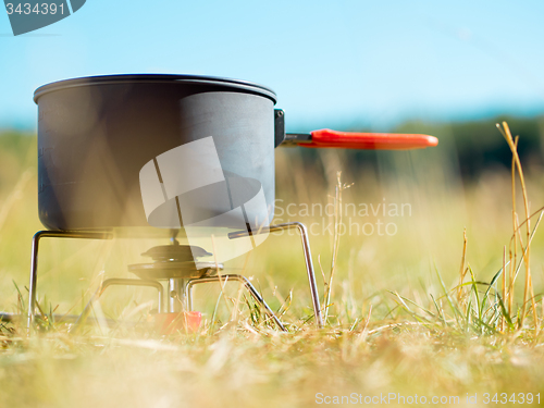 Image of Can on portable camping stove