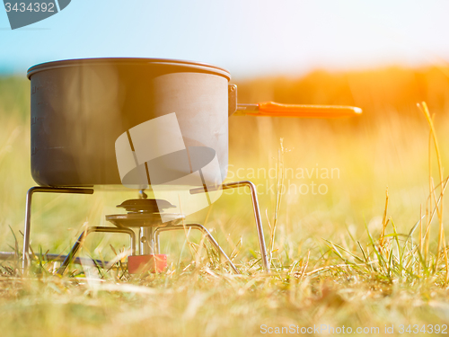 Image of Can on portable camping stove