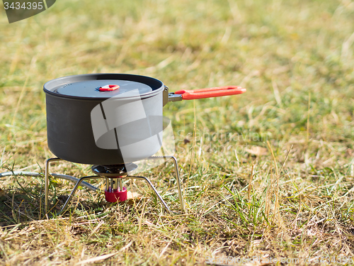 Image of Can on portable camping stove
