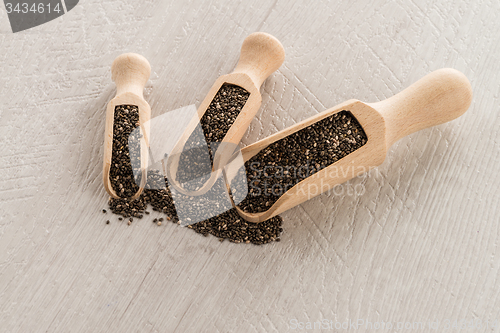 Image of Chia seeds in wooden scoops