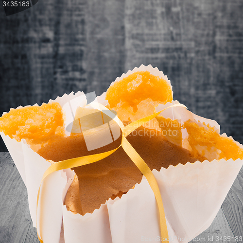 Image of Sponge cake on wooden background