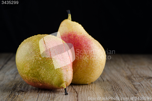 Image of Pears in a old wooden table