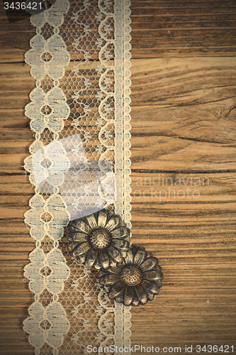 Image of vintage button and lace tape