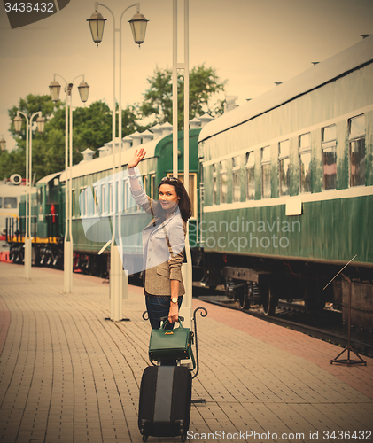 Image of Woman traveler with luggage