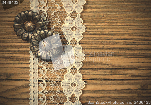 Image of vintage button and lace tape