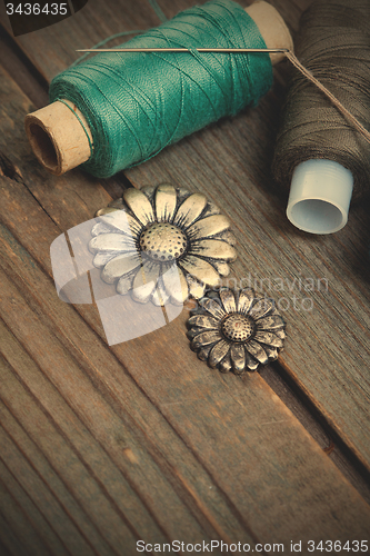 Image of spools of threads and vintage buttons