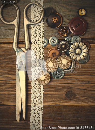 Image of vintage buttons, lace, and a dressmaker scissors