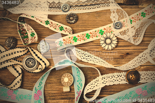 Image of ribbons, lace, tape and buttons