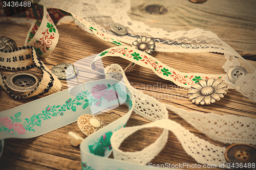 Image of ribbons, lace, tape and buttons