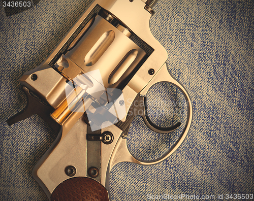 Image of Nagan revolver with cartridge