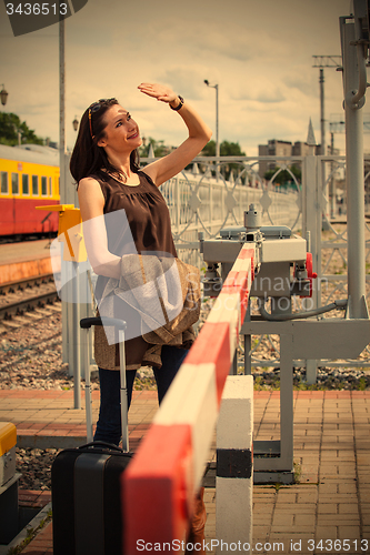 Image of woman near barrier at the border