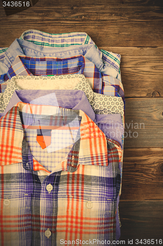 Image of stack of colored cotton shirts